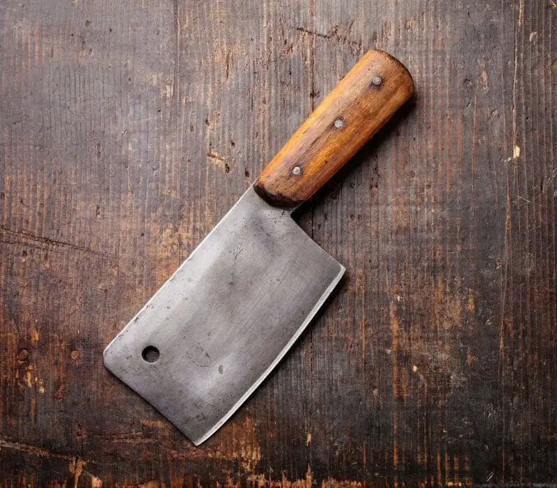 meat cleaver laying on wood