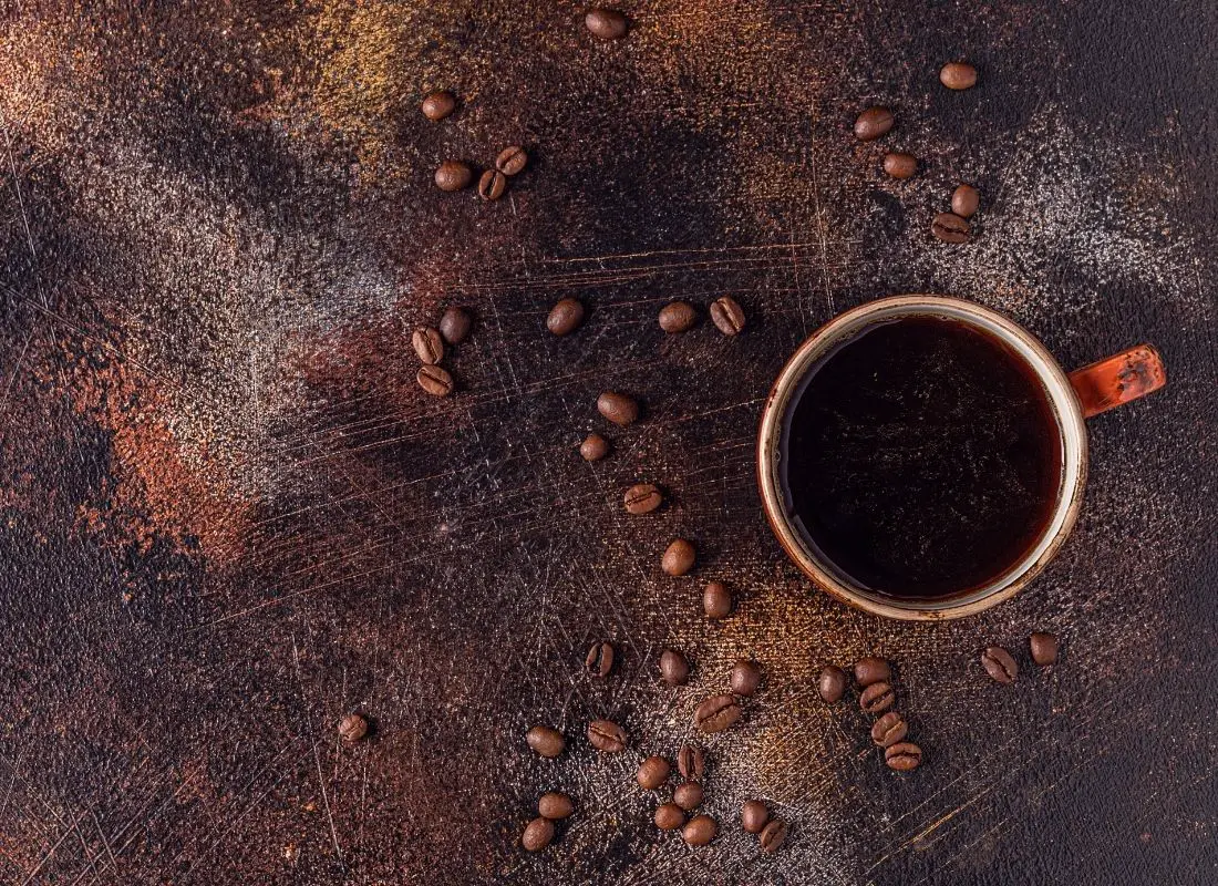 coffee cup and spilled beans