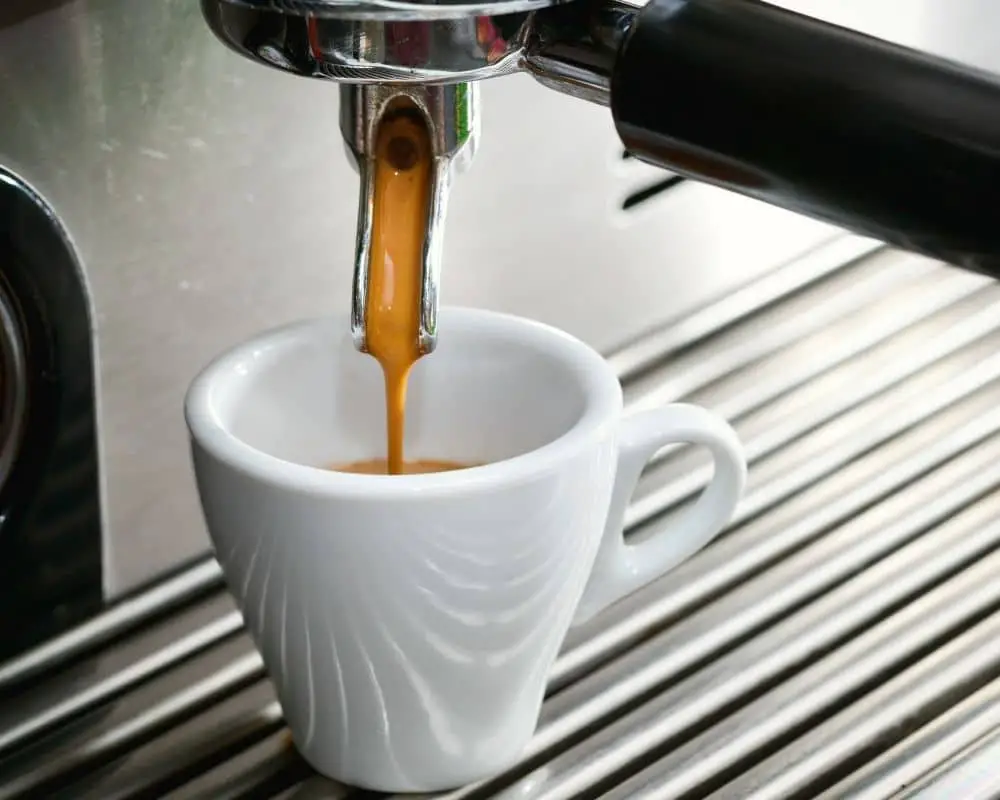 coffee pouring into white mug